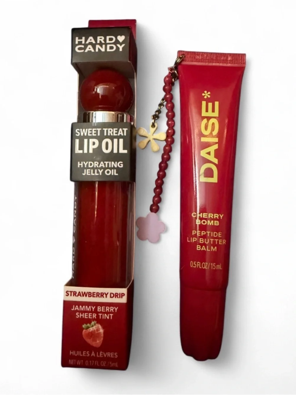 DAISE cherry bomb lip balm and Hard Candy strawberry lip oil